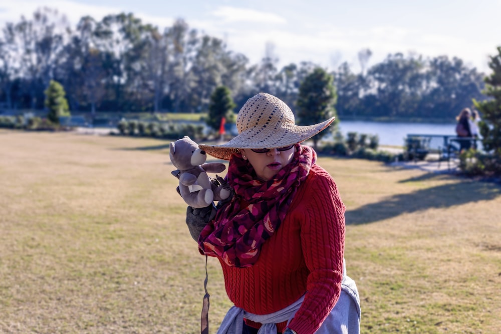 a woman wearing a cowboy hat and scarf