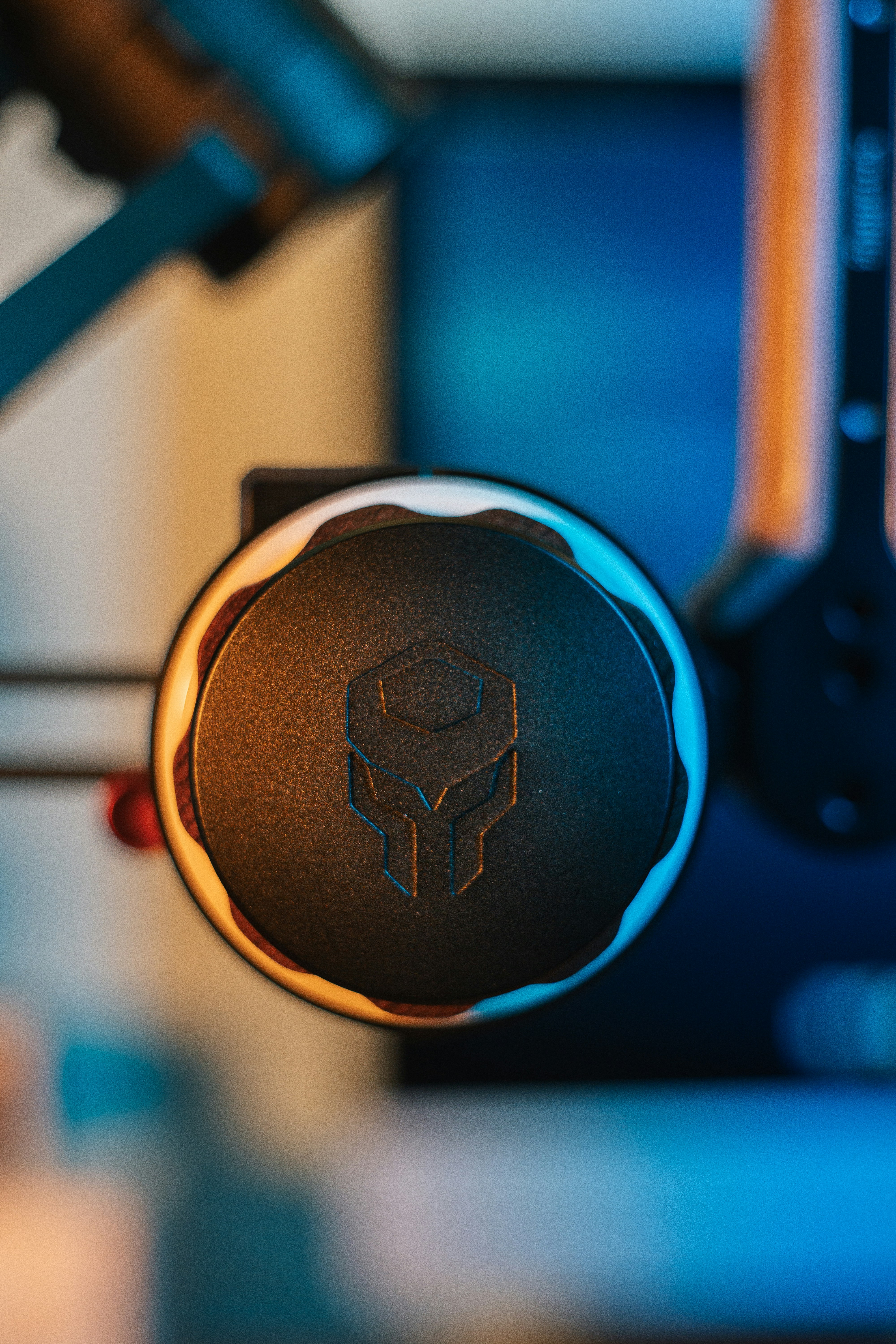 a close up of a black object with a blue background