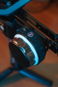 Close-up of a voice logger device with illuminated buttons in a professional setting.