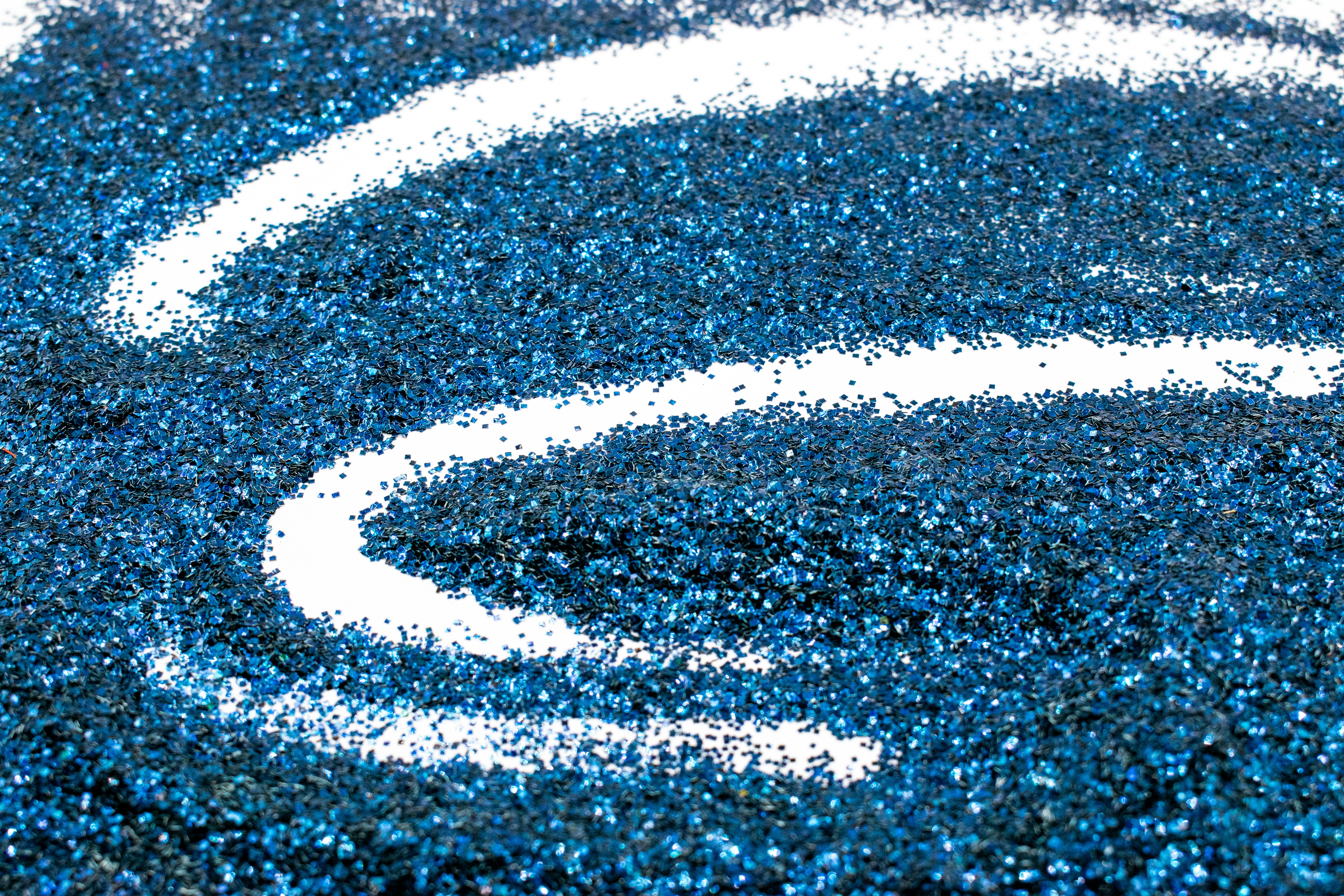 a close up of a blue and white rug