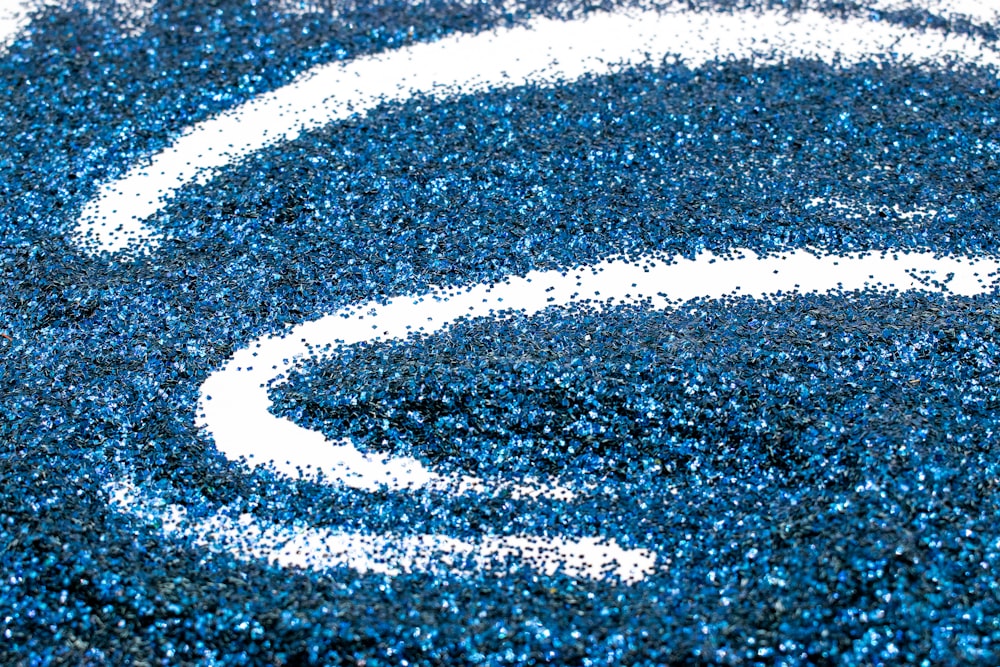 a close up of a blue and white rug
