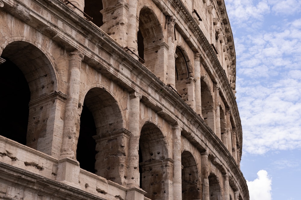 a close up of the side of an ancient building