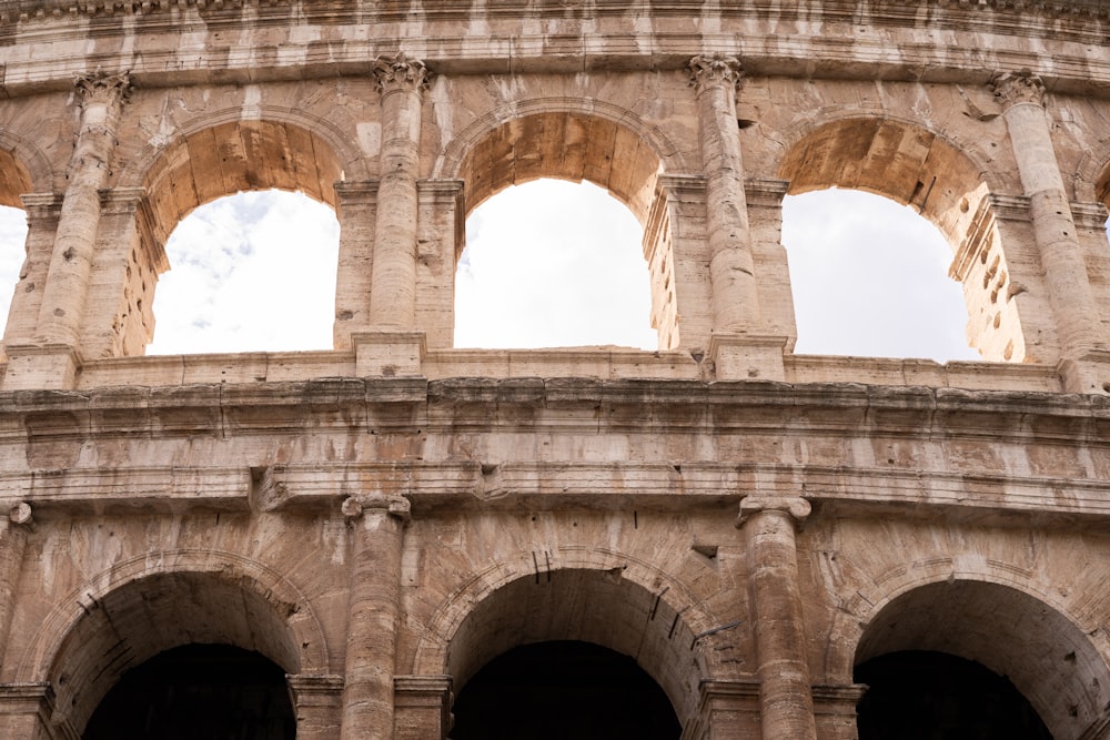 a close up of an old building with arches