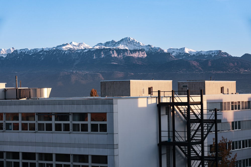 a view of a building with mountains in the background