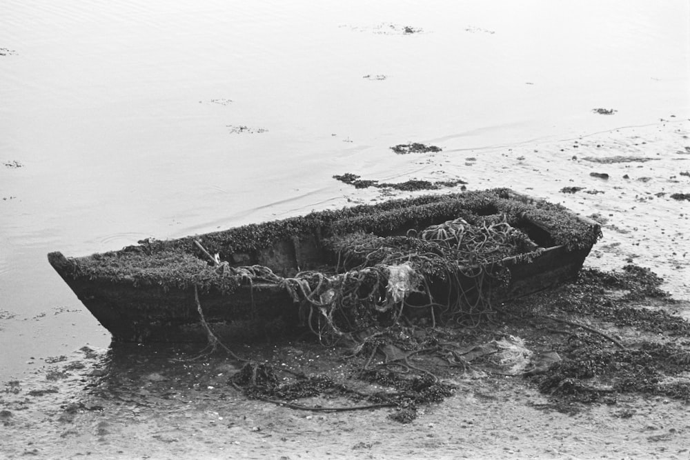 a boat that is sitting in the sand