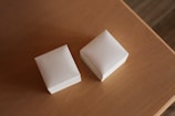 two pieces of paper sitting on top of a wooden table