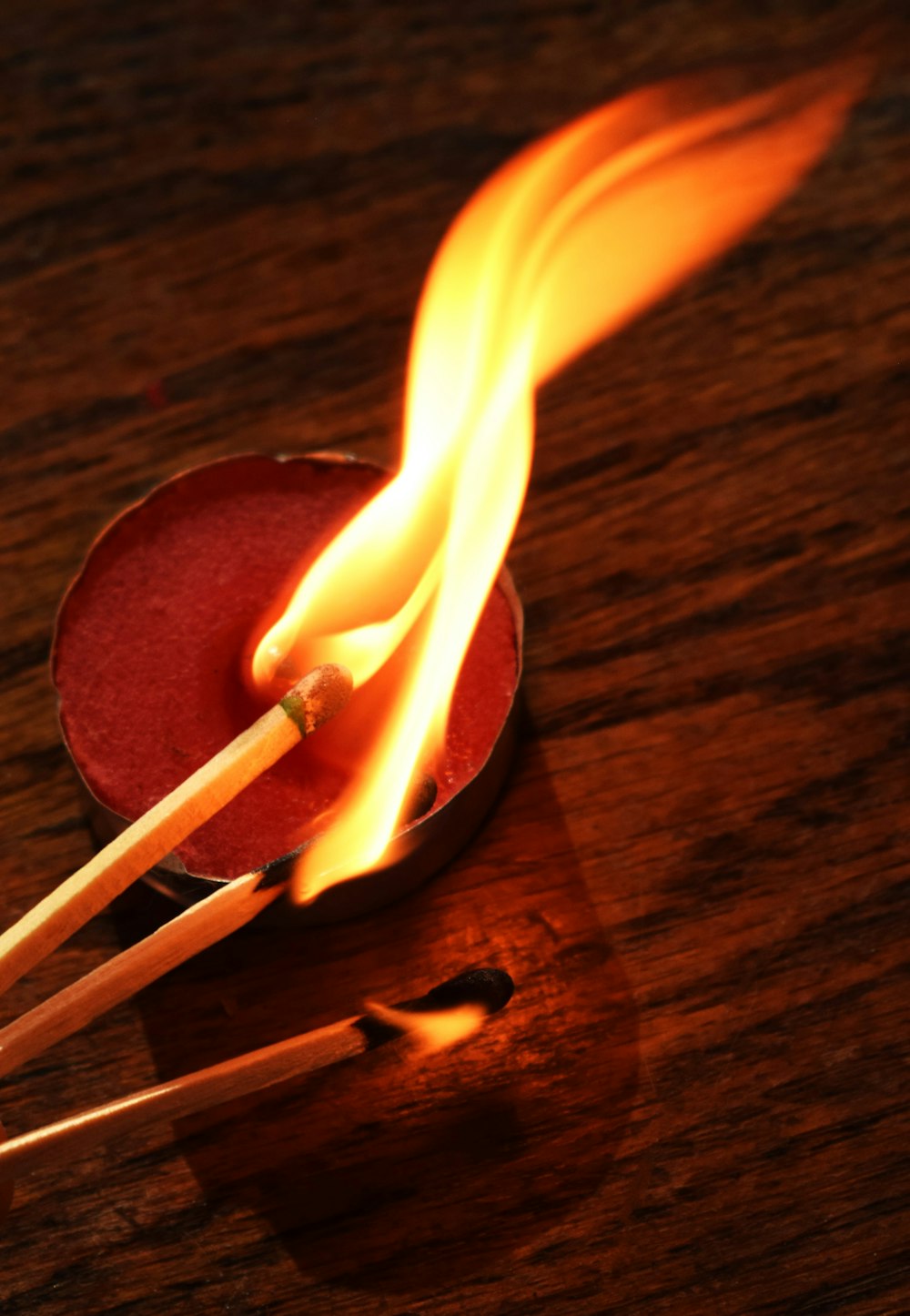 a close up of two matches on a table