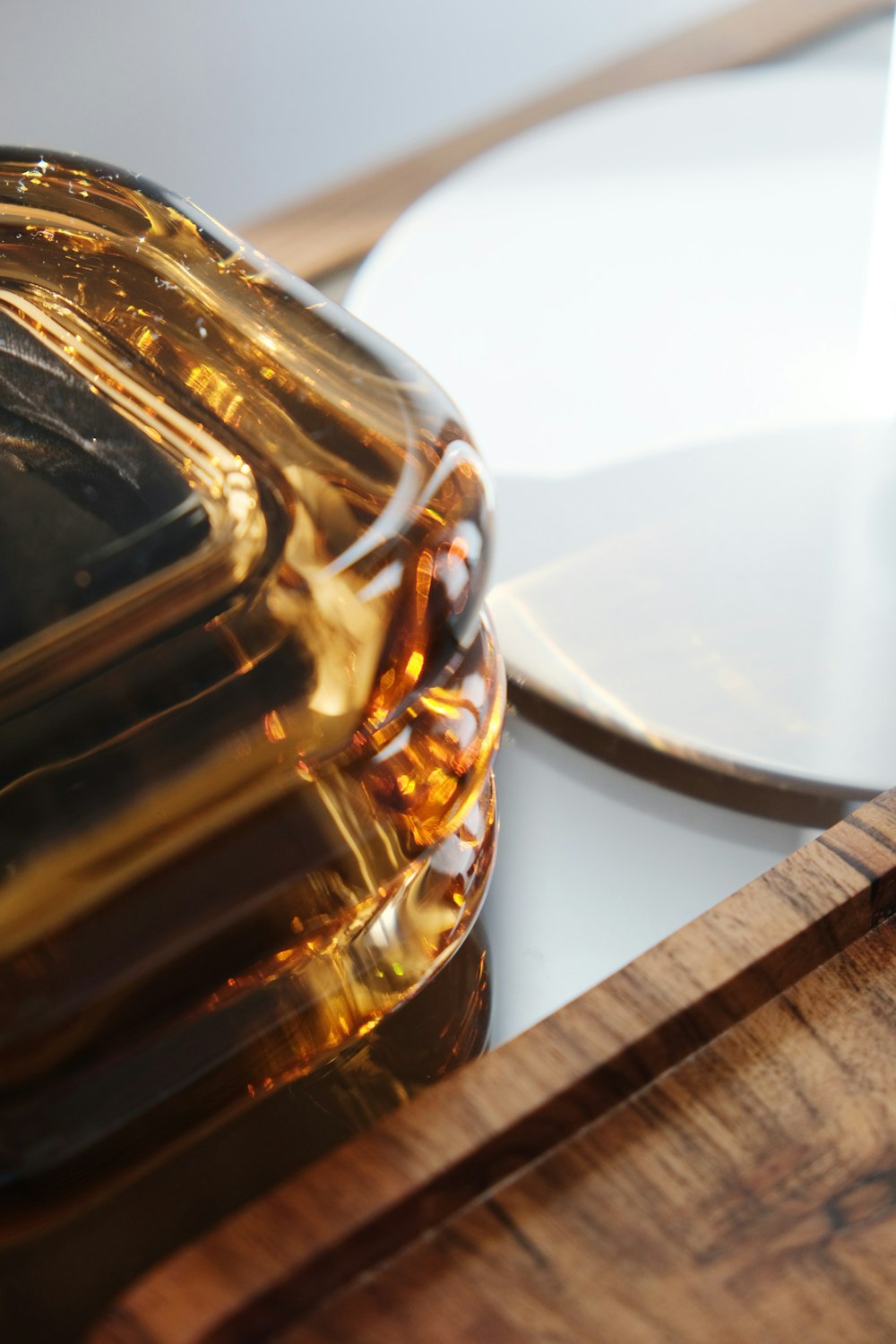 a close up of a bottle of oil on a table