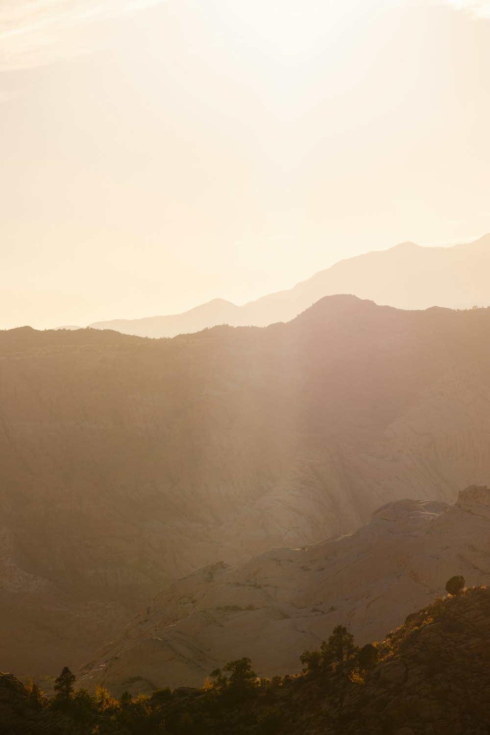 a view of a mountain range at sunset