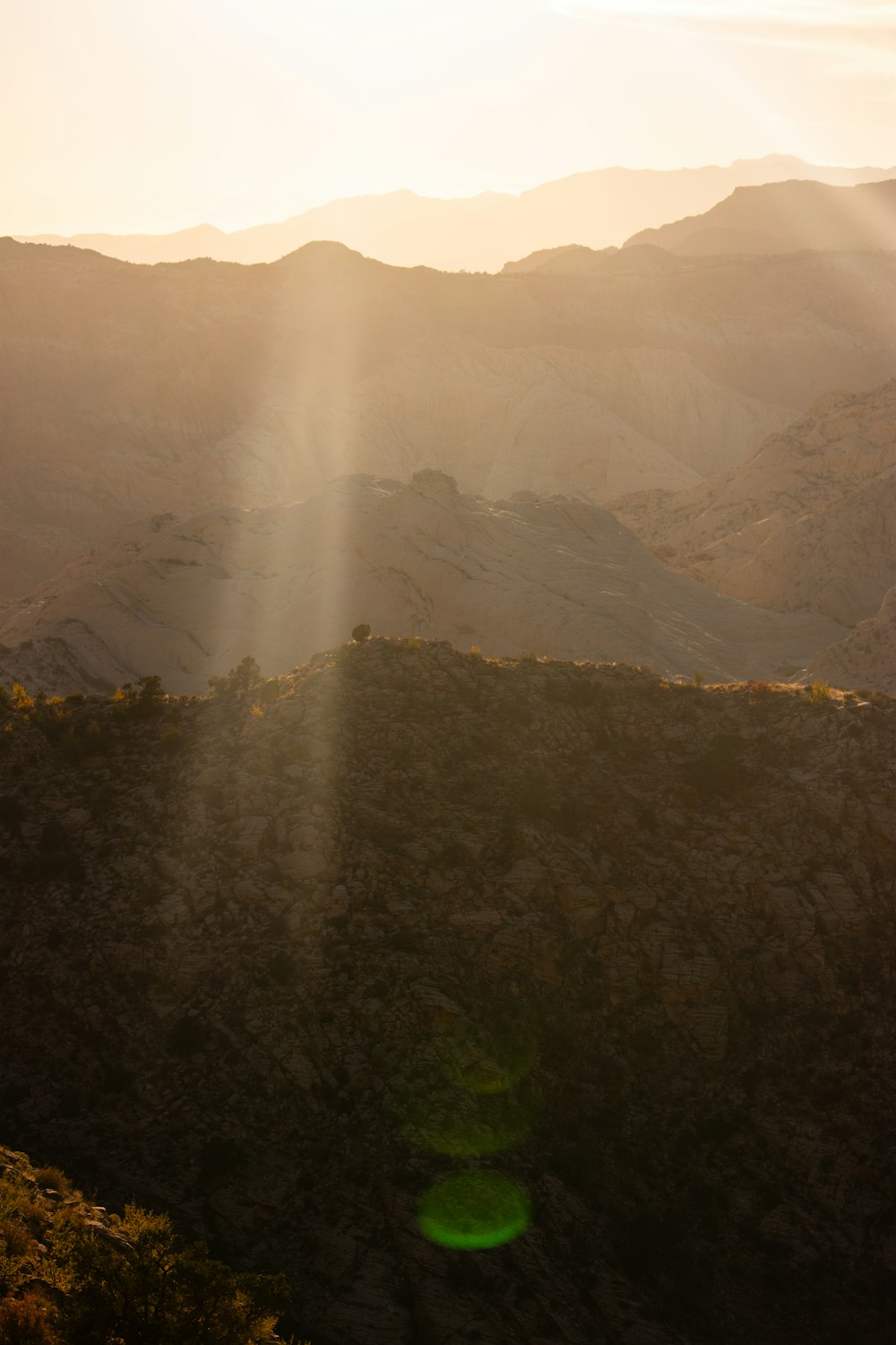 the sun is shining down on the mountains