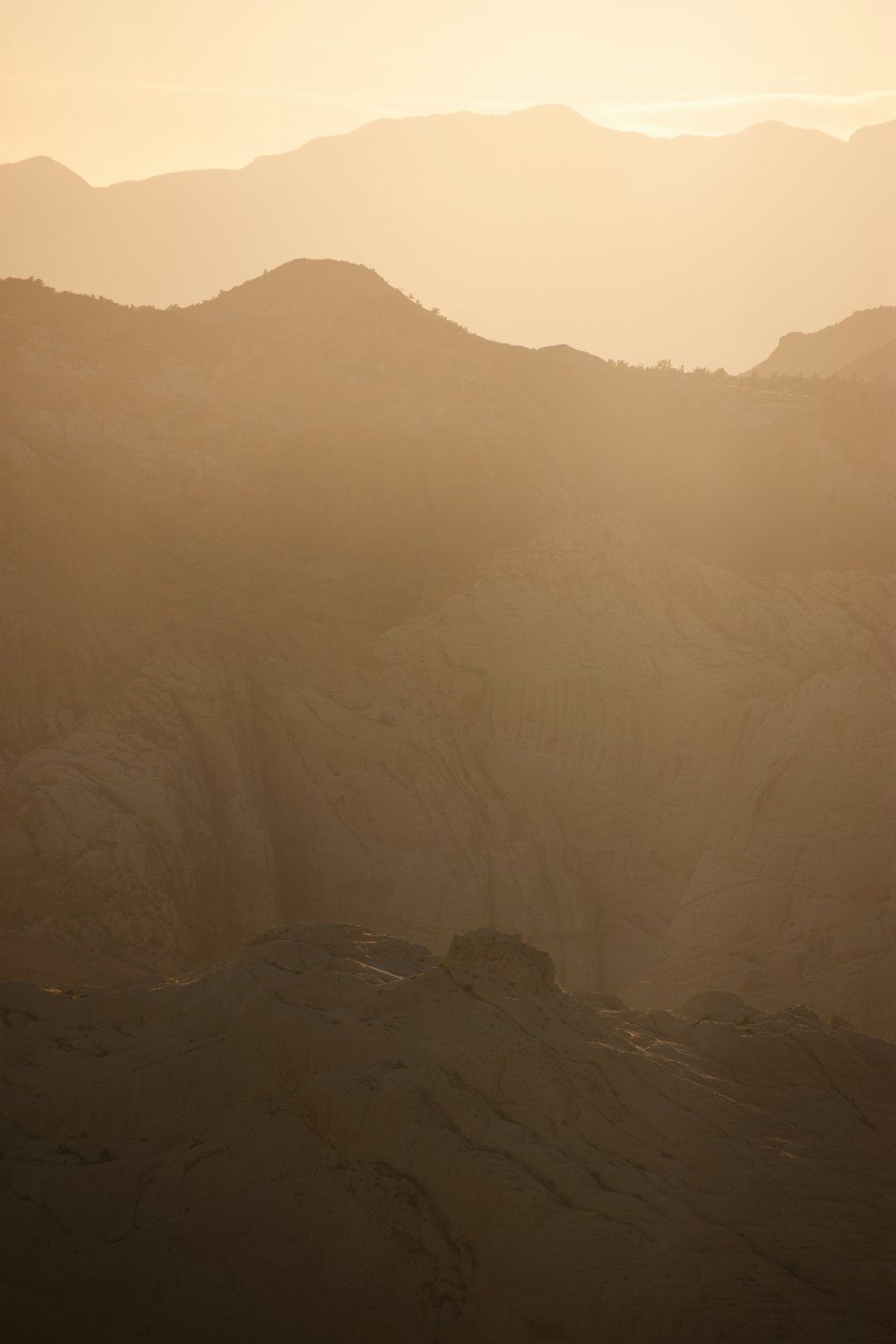 a view of a mountain range at sunset