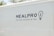 The side of a white vehicle displays the meal service logo 'MEALPRO' with the tagline 'For the Athlete in You'. Next to the text is a graphic combining a lightbulb and a fork.