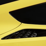 A tidparts body kit on a car in motion, showcasing smooth curves and dynamic design.