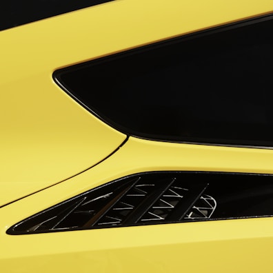 A tidparts body kit on a car in motion, showcasing smooth curves and dynamic design.