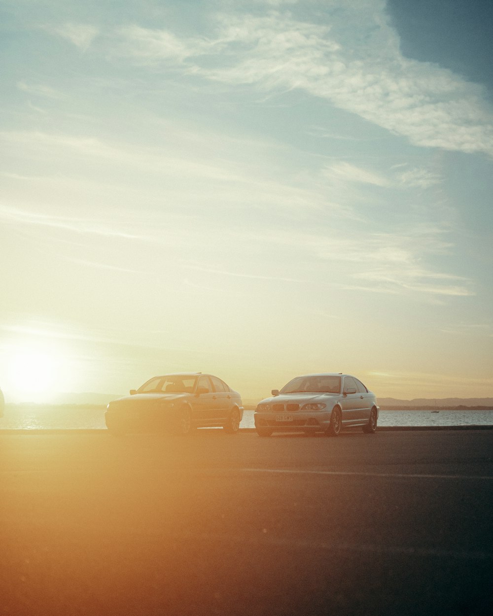 a couple of cars that are sitting in the street