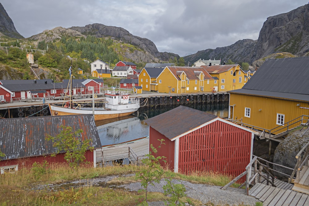 a group of buildings sitting next to a body of water