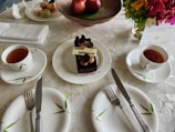 A beautifully arranged table with birthday treats and drinks.