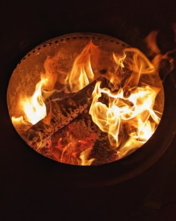 A close-up of crackling flames dancing in the fire pit