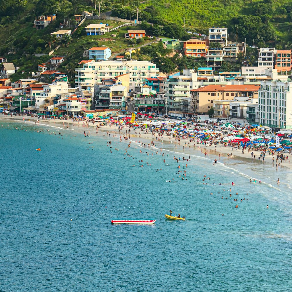 a crowded beach with a lot of people on it