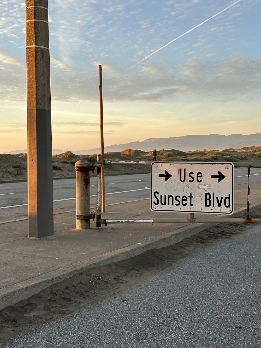 a street sign on the side of the road