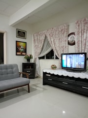 Cozy living room with sofa and TV