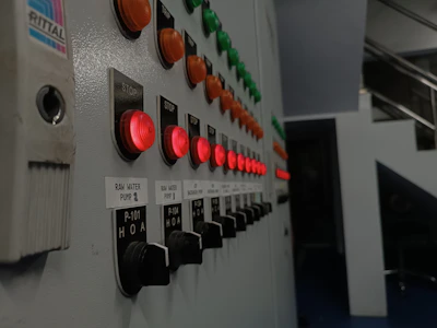 Close-up of a water purifier's control panel with glowing indicators.