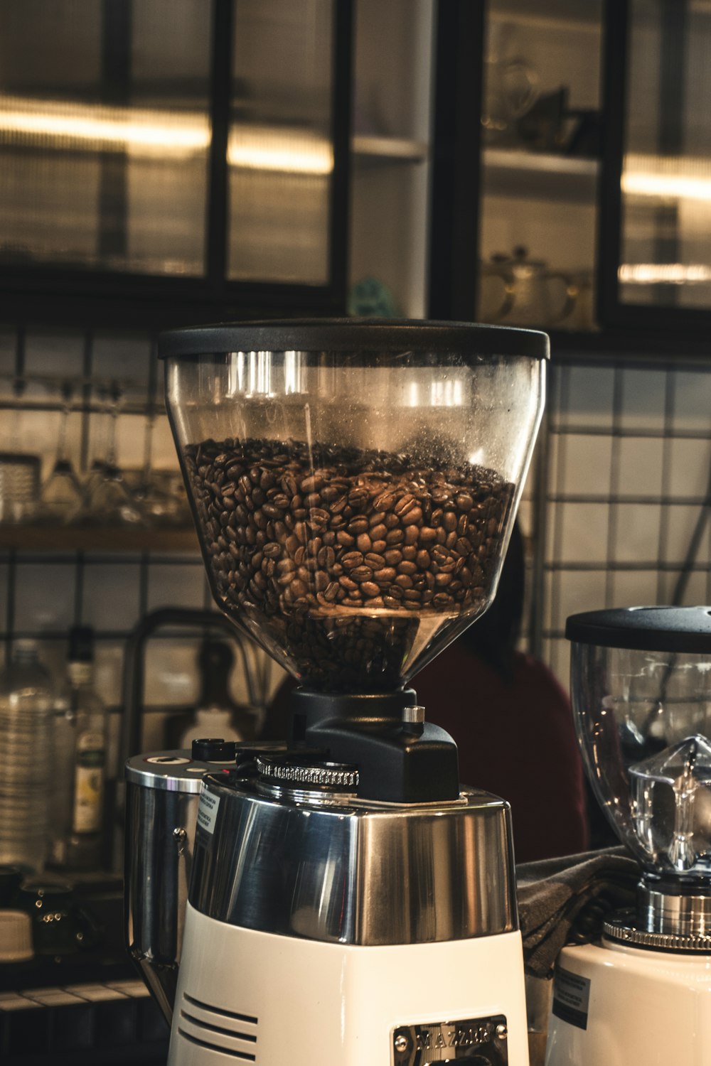 a coffee grinder sitting on top of a counter