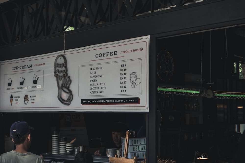 a man standing in front of a coffee shop