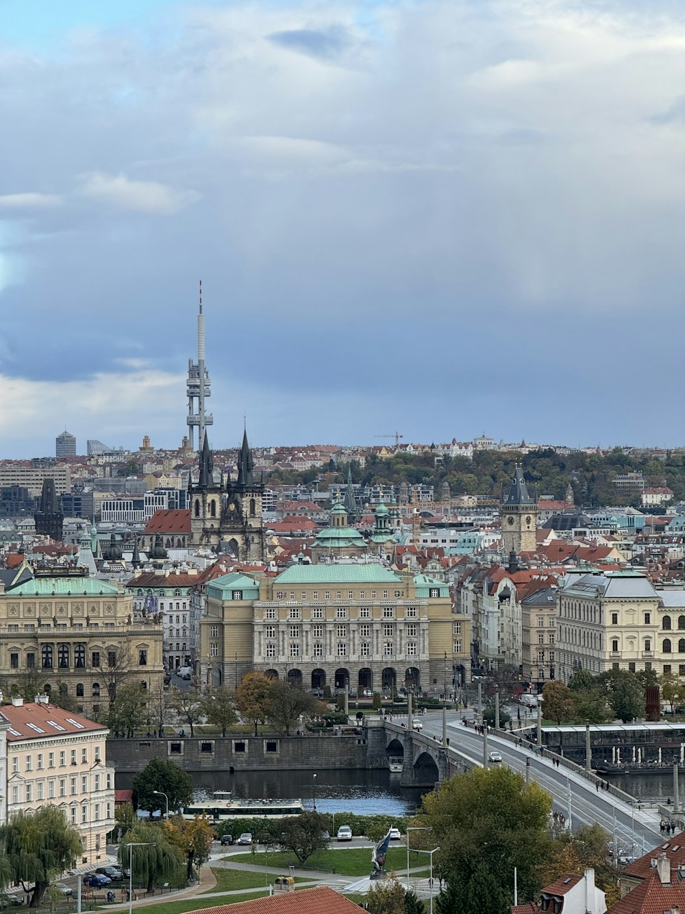 a view of a city with a bridge in the foreground