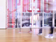 Dynamic view of smart glass panel switching modes in a contemporary corporate lobby.