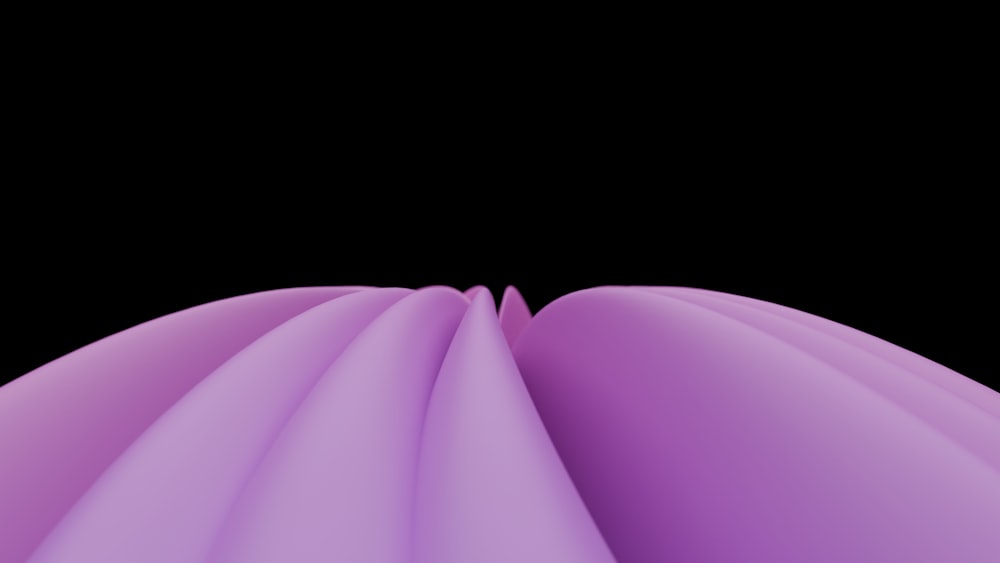 a black background with a purple object in the middle