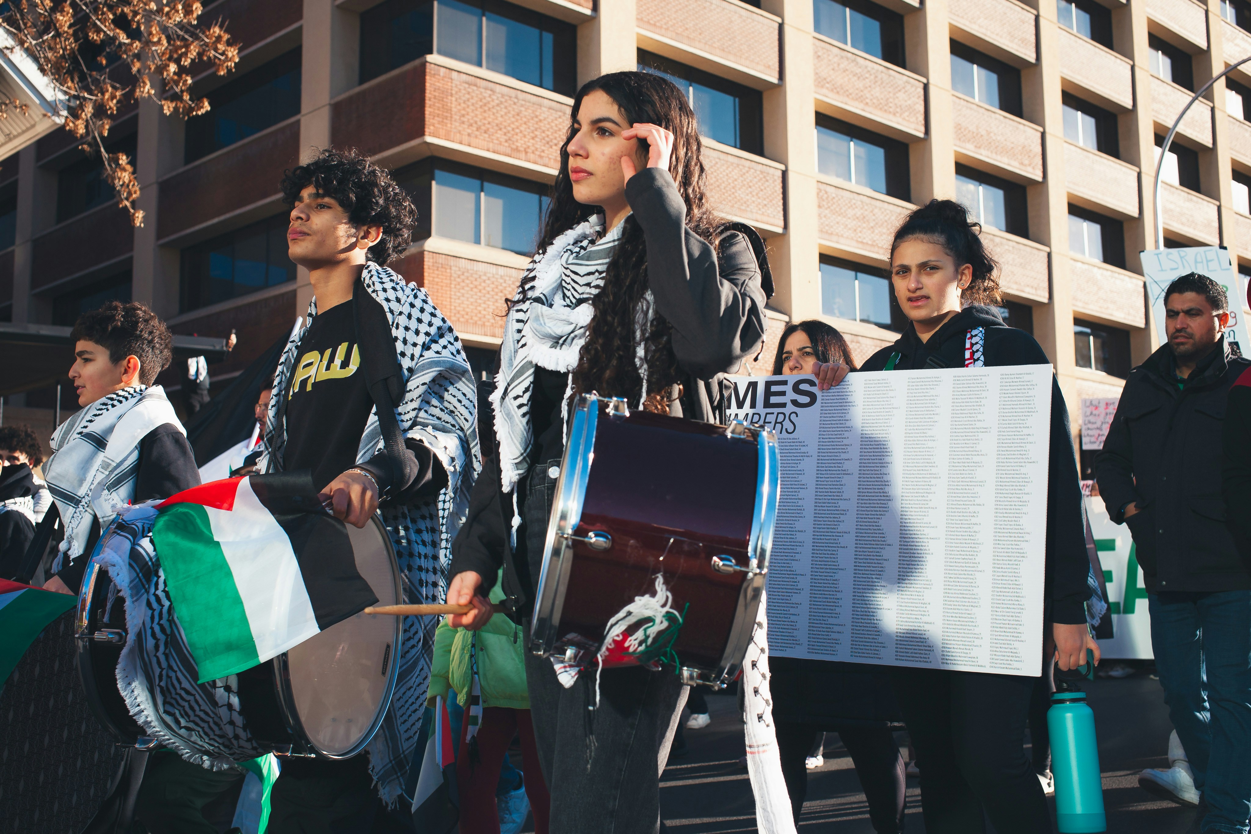 a group of people standing in the street