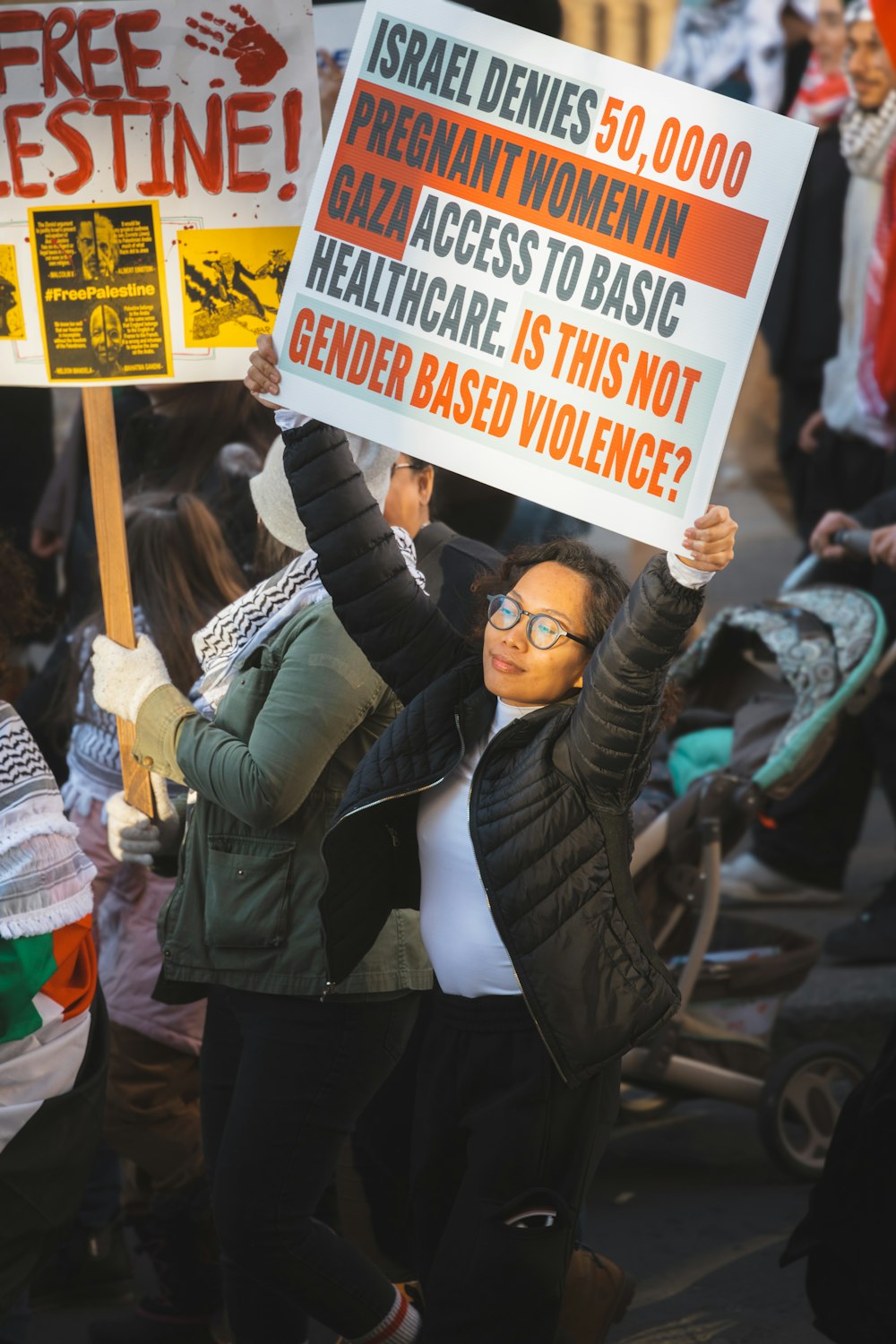 a group of people holding signs in the air