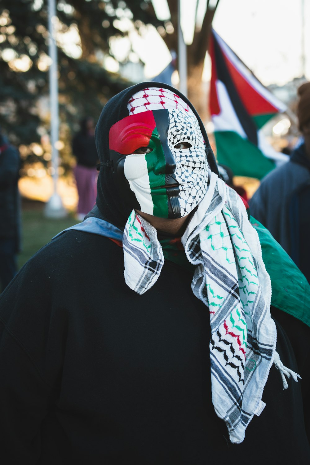 a man wearing a mask with a flag painted on it