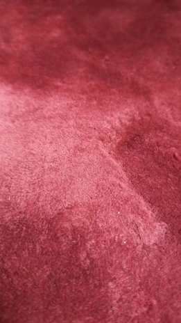 Close-up of a handcrafted product with rich textures and subtle, luxurious tones.