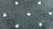 A textured dark fabric with a pattern of small, light-colored, star-like shapes evenly distributed across the surface. The texture appears plush and thick, indicating a potential use in upholstery or carpeting.