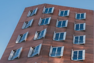 Wide view of a commercial building equipped with fire safety shutters and doors.