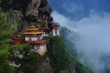 a mountain side with some buildings on top of it