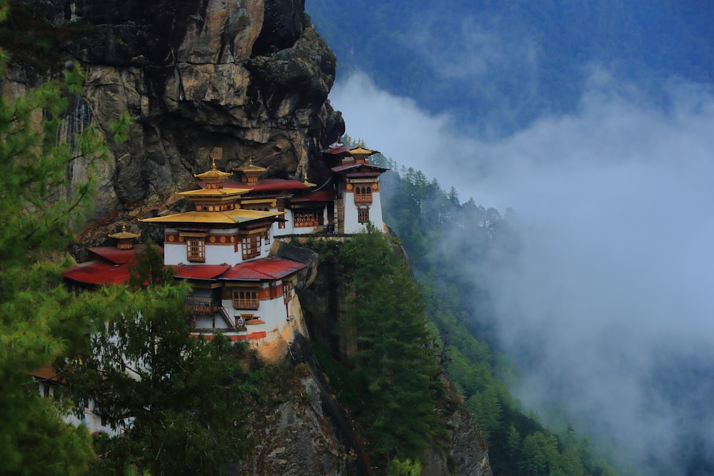 a mountain side with some buildings on top of it