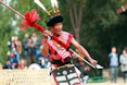 a man in a costume holding a sword