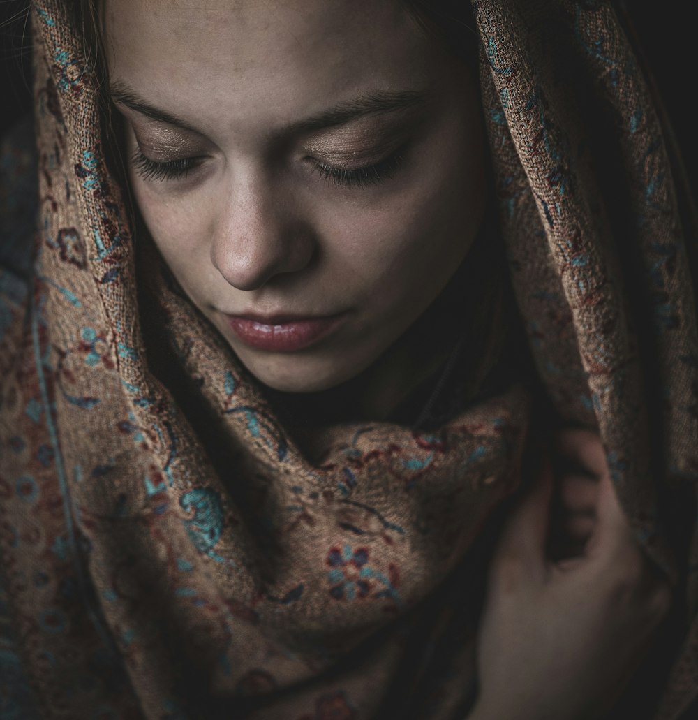 a woman with a scarf around her head