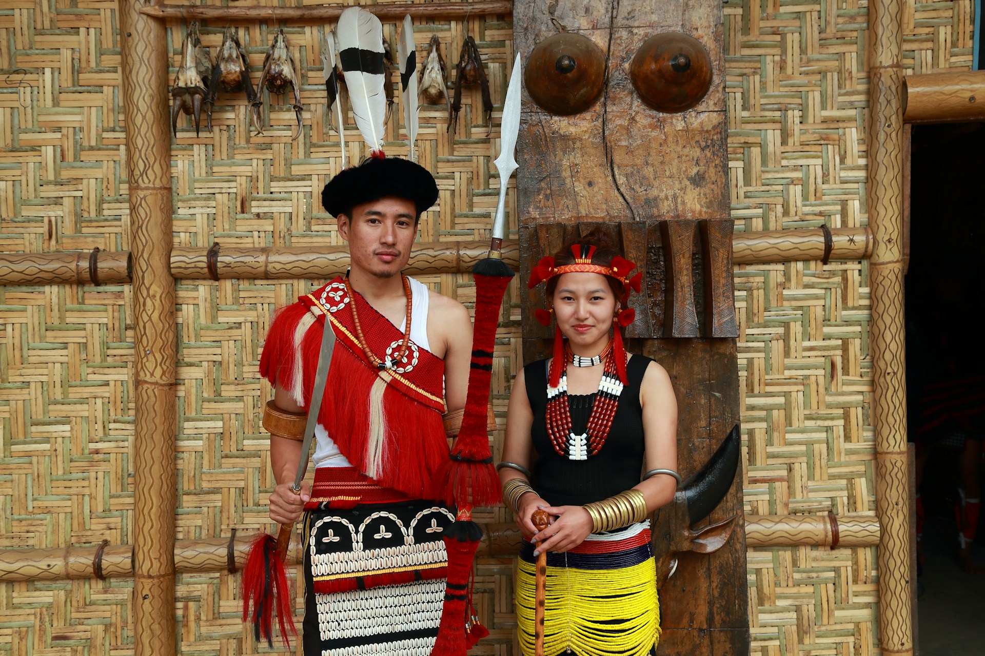 a man and a woman dressed in native american clothing