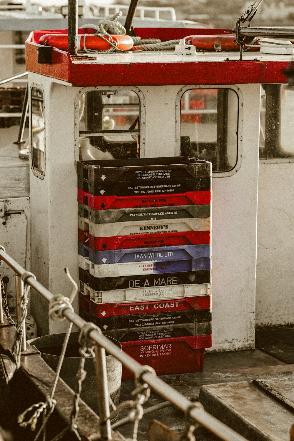 a stack of books sitting on top of a boat