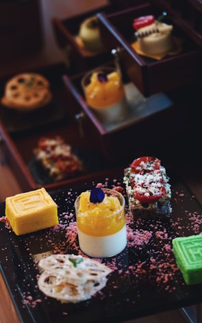 An assortment of colorful cakes and desserts.