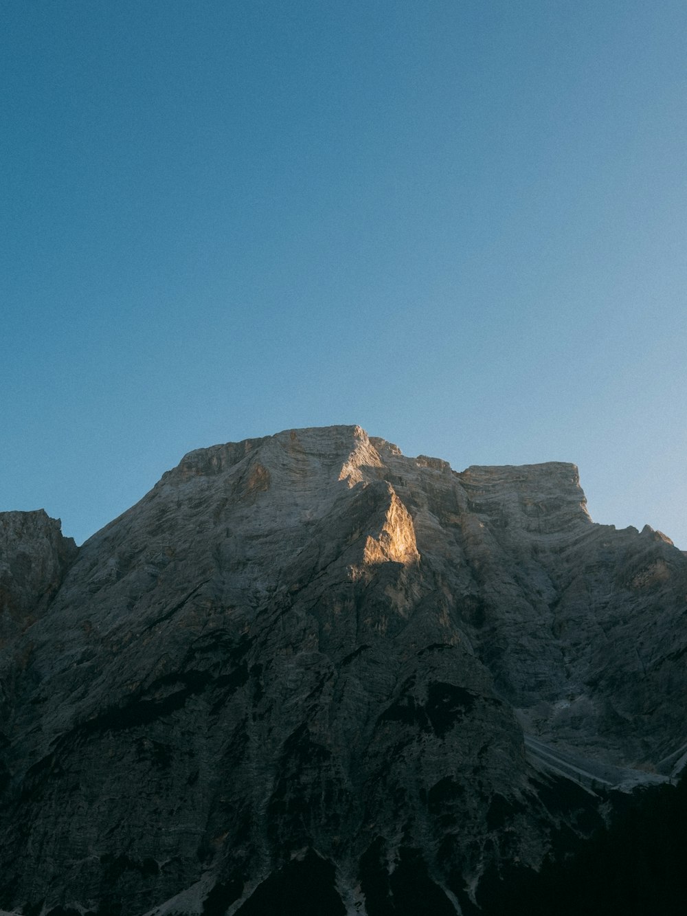 a view of the top of a mountain from below