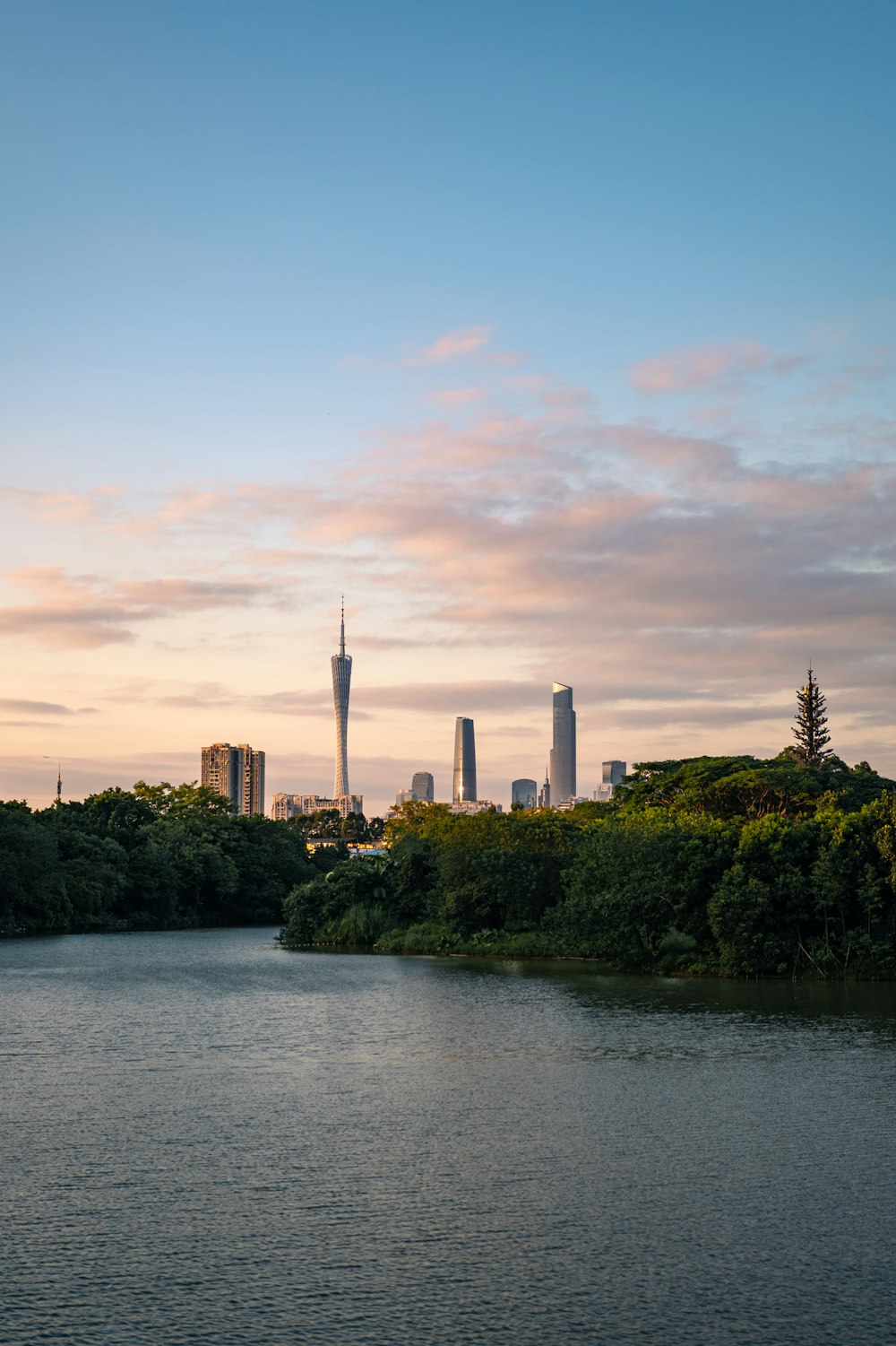 a body of water with a city in the background