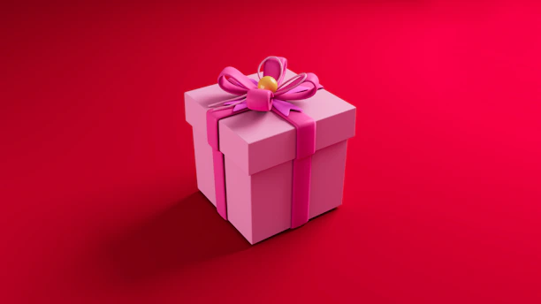 Cute charity piggy banks and wrapped gift boxes tied with pink ribbons on a bright surface.