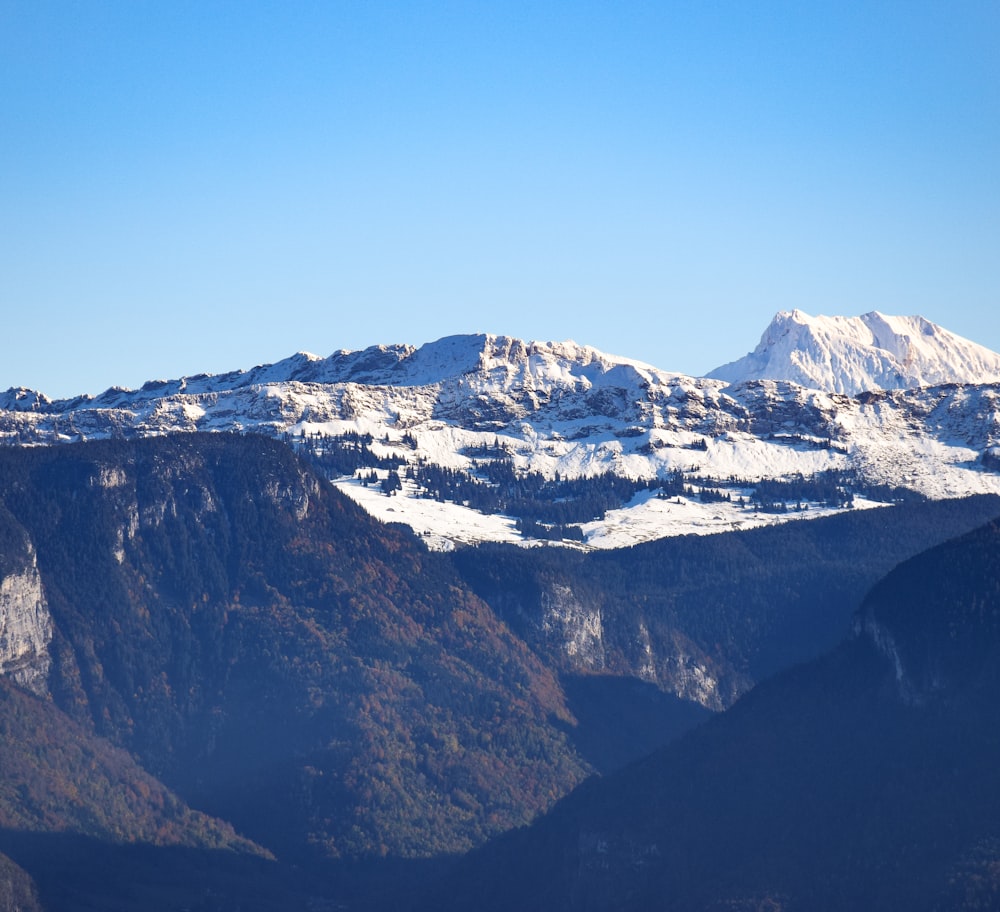 a view of a mountain range covered in snow