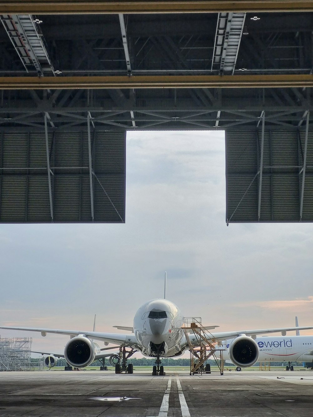 a large jetliner sitting on top of an airport tarmac