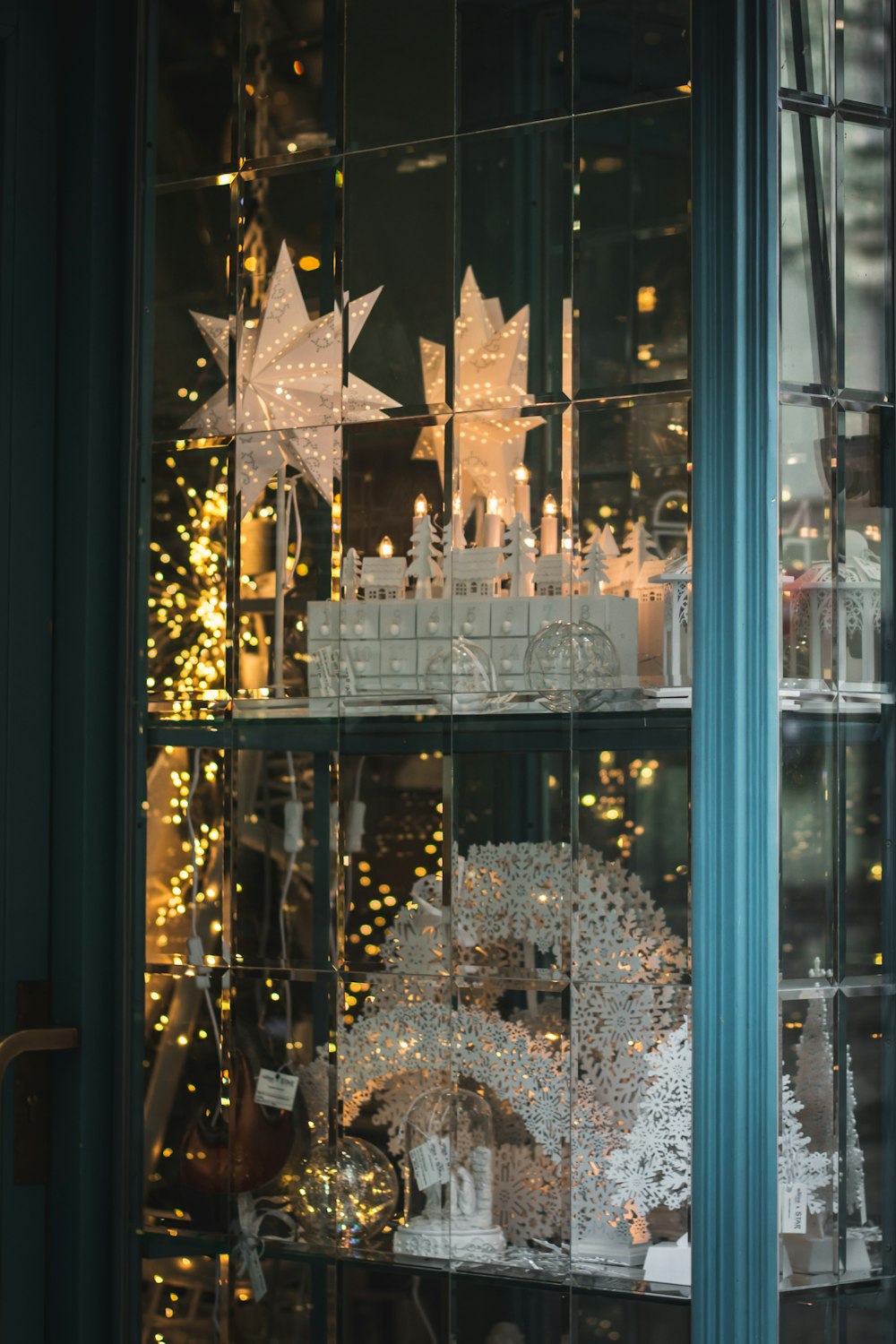 a display case filled with lots of white christmas decorations